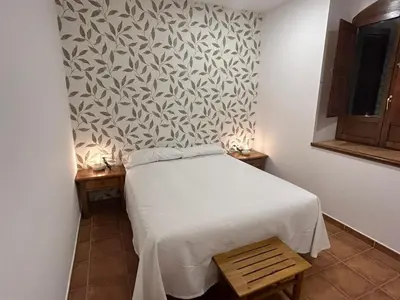 Cama o camas de una habitación en Hostal Villa el Colmenar