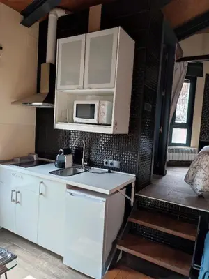 Una cocina o zona de cocina en la casa de las cabilas