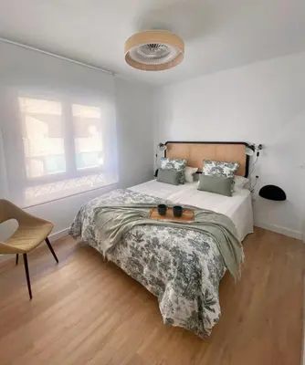 Cama o camas de una habitación en Apartamento La Muralla
