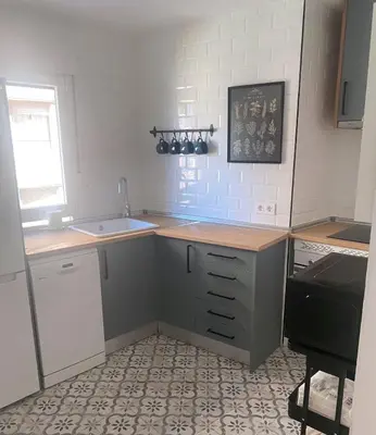 Una cocina o zona de cocina en Apartamento La Muralla