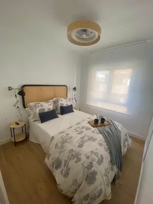 Cama o camas de una habitación en Apartamento La Muralla