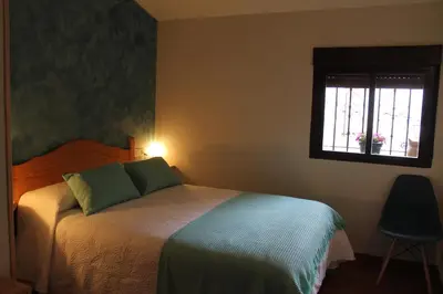 Cama o camas de una habitación en EL CORRAL DE LA VERA